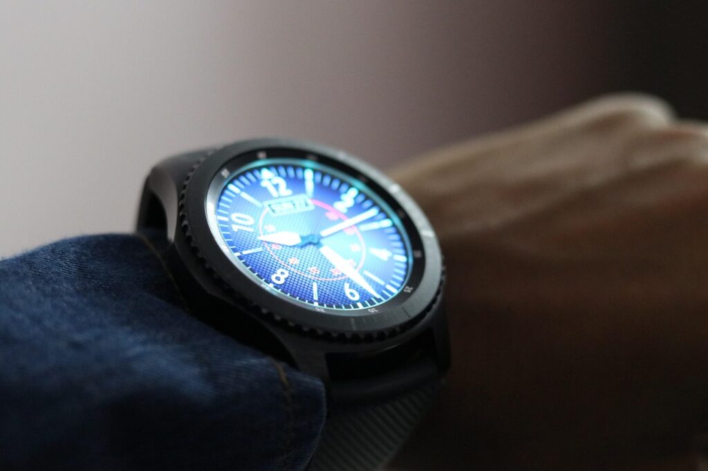 Smartwatch on UK wrist showing fitness stats